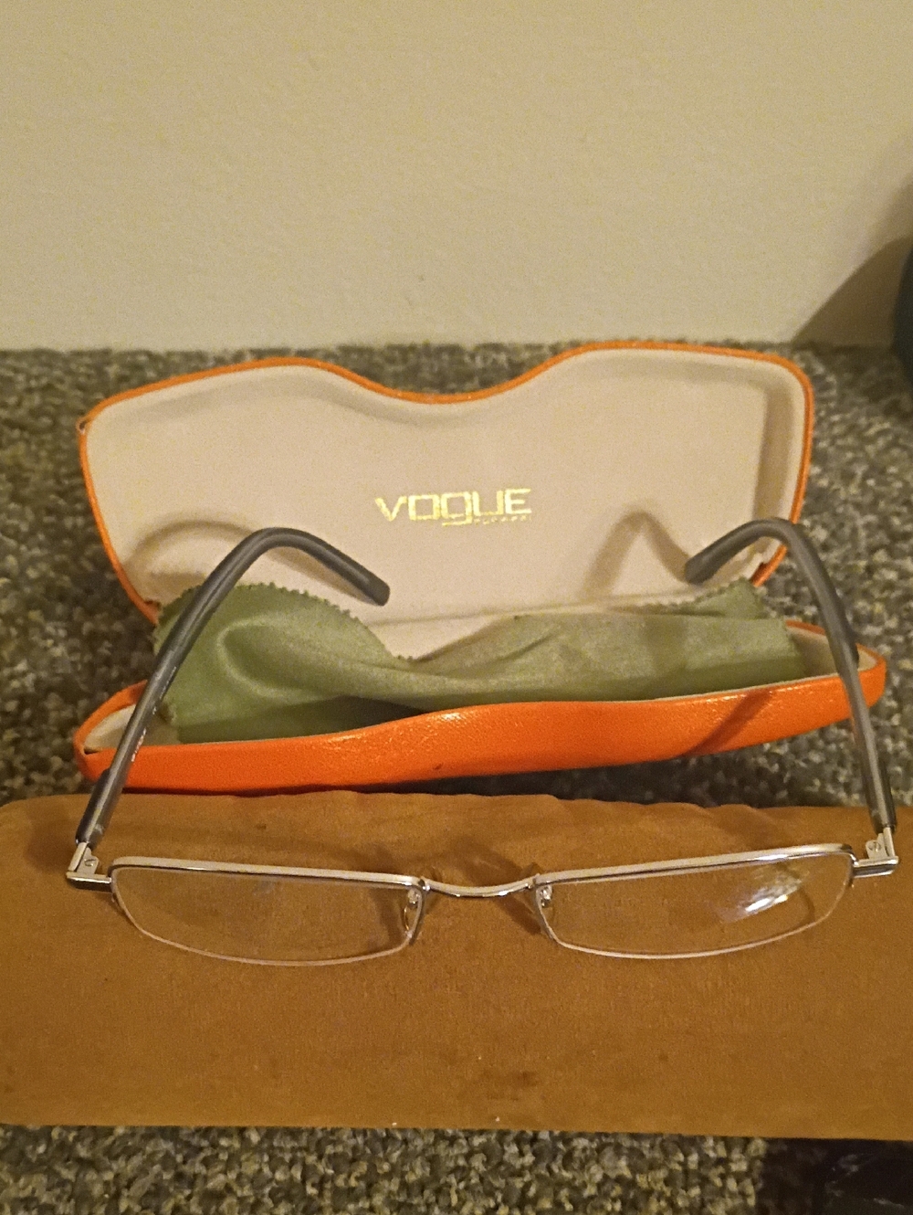 Vogue Silver Rimless Rectangular Glasses with Orange Case
